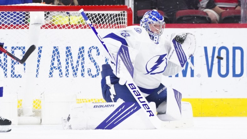 Jun 1, 2021; Raleigh, North Carolina, USA; Tampa Bay Lightning goaltender Andrei Vasilevskiy (88) gets ready to make a glove save against the Carolina Hurricanes in game two of the second round of the 2021 Stanley Cup Playoffs at PNC Arena. Mandatory Credit: James Guillory-USA TODAY Sports