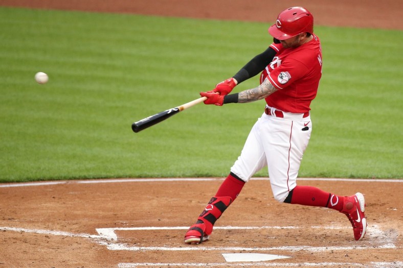 Cincinnati Reds center fielder Tyler Naquin (12) hits a two-run home run during the second inning of a baseball game against the Philadelphia Phillies, Tuesday, June 1, 2021, at Great American Ball Park in Cincinnati.

Philadelphia Phillies At Cincinnati Reds June 1