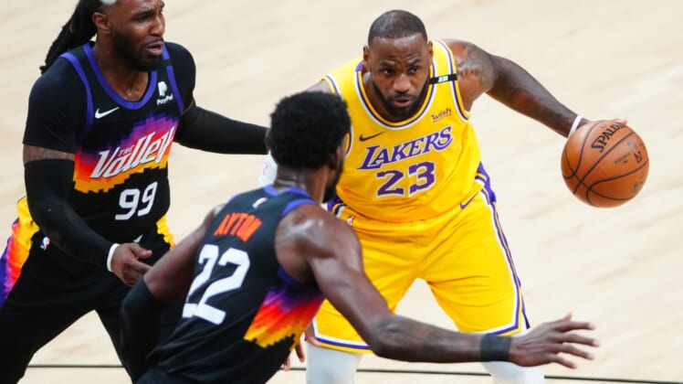 Jun 1, 2021; Phoenix, Arizona, USA; Los Angeles Lakers forward LeBron James (23) drives to the basket against the Phoenix Suns in the first half during game five in the first round of the 2021 NBA Playoffs at Phoenix Suns Arena. Mandatory Credit: Mark J. Rebilas-USA TODAY Sports