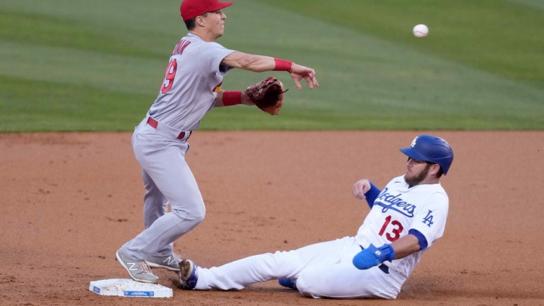 Jun 1, 2021; Los Angeles, California, USA; St. Louis Cardinals second baseman Tommy Edman (19) forces out Los Angeles Dodgers second baseman Max Muncy (13) out at second base in the first inning at Dodger Stadium. Mandatory Credit: Kirby Lee-USA TODAY Sports