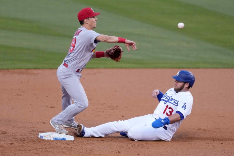 Jun 1, 2021; Los Angeles, California, USA; St. Louis Cardinals second baseman Tommy Edman (19) forces out Los Angeles Dodgers second baseman Max Muncy (13) out at second base in the first inning at Dodger Stadium. Mandatory Credit: Kirby Lee-USA TODAY Sports