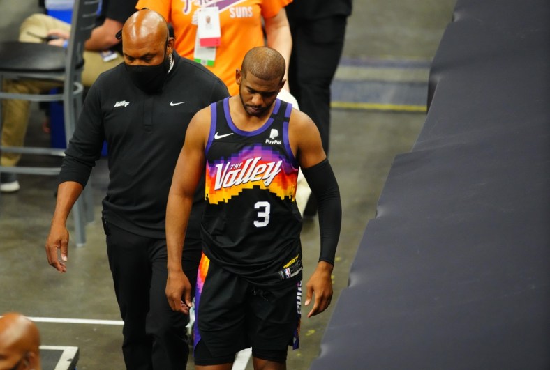 Jun 1, 2021; Phoenix, Arizona, USA; Phoenix Suns guard Chris Paul (3) leaves the game after suffering an injury against the Los Angeles Lakers in the second half during game five in the first round of the 2021 NBA Playoffs at Phoenix Suns Arena. Mandatory Credit: Mark J. Rebilas-USA TODAY Sports