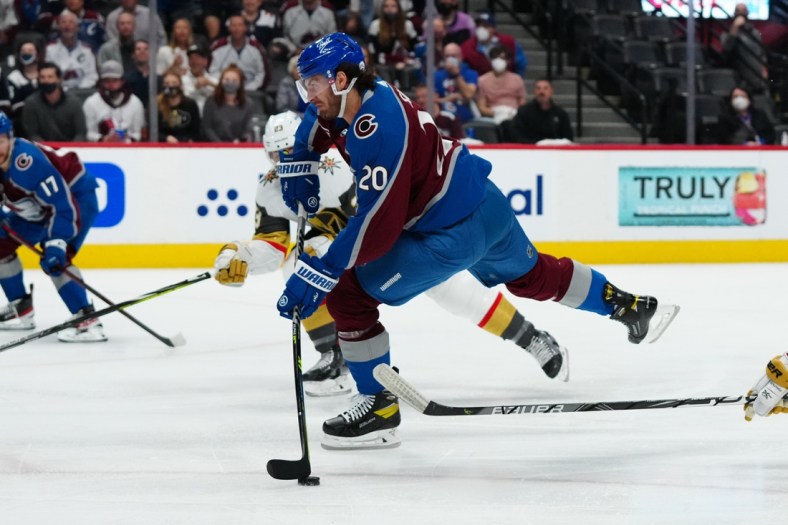 Jun 2, 2021; Denver, Colorado, USA; Colorado Avalanche left wing Brandon Saad (20) shoots and scores a goal in the first period against the Vegas Golden Knights  in game two of the second round of the 2021 Stanley Cup Playoffs at Ball Arena. Mandatory Credit: Ron Chenoy-USA TODAY Sports