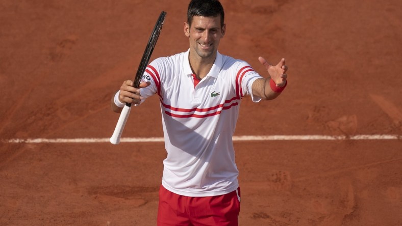 Jun 3, 2021; Paris, France;  Novak Djokovic (SRB) celebrates winning his match against Pablo Cuevas (URU) on day five of the French Open at Stade Roland Garros. Mandatory Credit: Susan Mullane-USA TODAY Sports