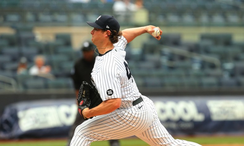 Jun 3, 2021; Bronx, New York, USA;  New York Yankees starting pitcher Gerrit Cole (45) pitches against the Tampa Bay Rays during the first inning at Yankee Stadium. Mandatory Credit: Andy Marlin-USA TODAY Sports
