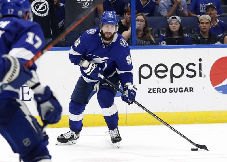 Jun 3, 2021; Tampa, Florida, USA; Tampa Bay Lightning right wing Nikita Kucherov (86) passes the puck against the Carolina Hurricanes during the third period in game three of the second round of the 2021 Stanley Cup Playoffs at Amalie Arena. Mandatory Credit: Kim Klement-USA TODAY Sports