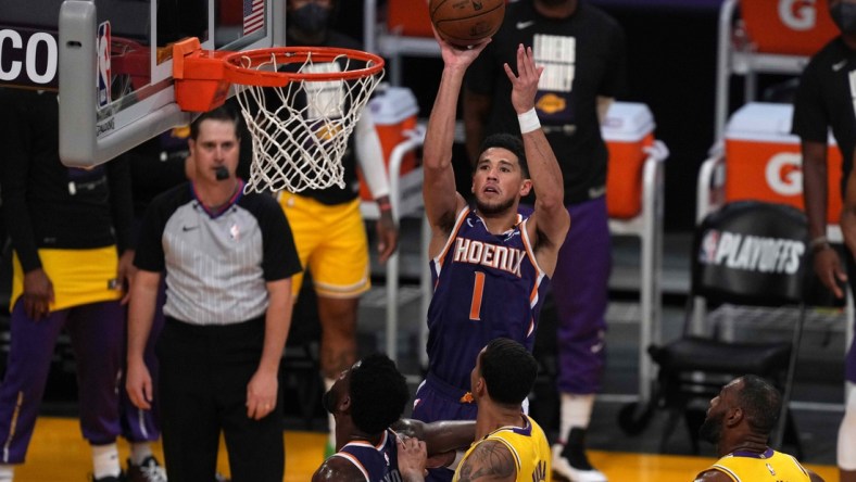 Jun 3, 2021; Los Angeles, California, USA; Phoenix Suns guard Devin Booker (1) shoots the ball in the first quarter against the Los Angeles Lakers during game six in the first round of the 2021 NBA Playoffs at Staples Center. Mandatory Credit: Kirby Lee-USA TODAY Sports