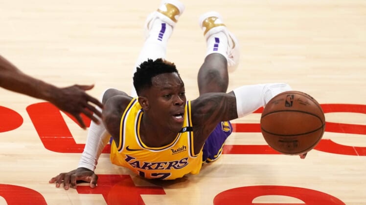 Jun 3, 2021; Los Angeles, California, USA; Los Angeles Lakers guard Dennis Schroder (17) reaches for the ball against the Phoenix Suns in the second half during game six in the first round of the 2021 NBA Playoffs at Staples Center. Mandatory Credit: Kirby Lee-USA TODAY Sports