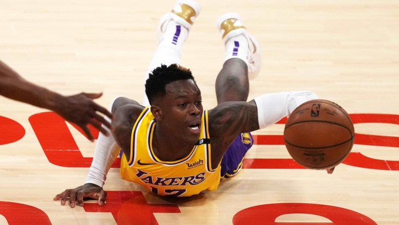 Jun 3, 2021; Los Angeles, California, USA; Los Angeles Lakers guard Dennis Schroder (17) reaches for the ball against the Phoenix Suns in the second half during game six in the first round of the 2021 NBA Playoffs at Staples Center. Mandatory Credit: Kirby Lee-USA TODAY Sports