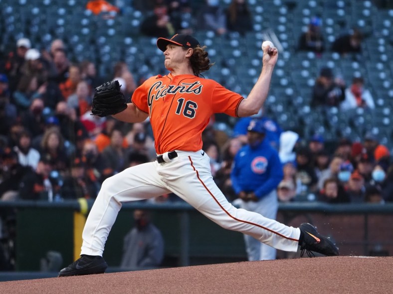 Jun 4, 2021; San Francisco, California, USA; San Francisco Giants starting pitcher Scott Kazmir (16) pitches the ball against the Chicago Cubs during the first inning at Oracle Park. Mandatory Credit: Kelley L Cox-USA TODAY Sports