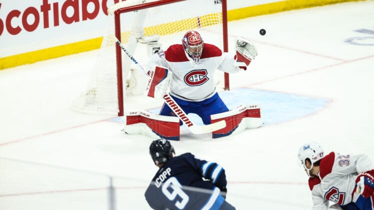 Jun 4, 2021; Winnipeg, Manitoba, CAN; Winnipeg Jets forward Andrew Copp (9) shoots wide of Montreal Canadiens goalie Carey Price (31) during the first period in game two of the second round of the 2021 Stanley Cup Playoffs at Bell MTS Place. Mandatory Credit: Terrence Lee-USA TODAY Sports