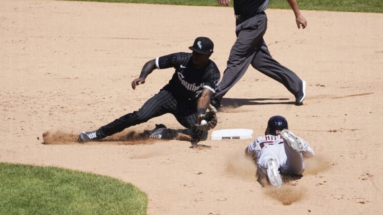 Jun 5, 2021; Chicago, Illinois, USA; Detroit Tigers center fielder Derek Hill (54) steals second base as Chicago White Sox shortstop Tim Anderson (7) takes a late throw during the fifth inning at Guaranteed Rate Field. Mandatory Credit: David Banks-USA TODAY Sports