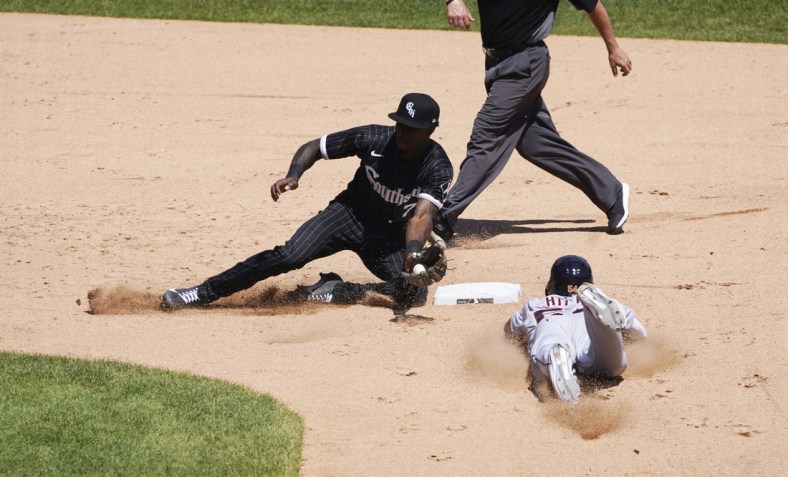 Jun 5, 2021; Chicago, Illinois, USA; Detroit Tigers center fielder Derek Hill (54) steals second base as Chicago White Sox shortstop Tim Anderson (7) takes a late throw during the fifth inning at Guaranteed Rate Field. Mandatory Credit: David Banks-USA TODAY Sports