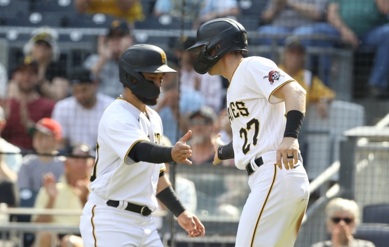 Jun 5, 2021; Pittsburgh, Pennsylvania, USA;  Pittsburgh Pirates left fielder Ka'ai Tom (left) and shortstop Kevin Newman (27) celebrate after scoring runs against the Miami Marlins during the second inning at PNC Park. Mandatory Credit: Charles LeClaire-USA TODAY Sports
