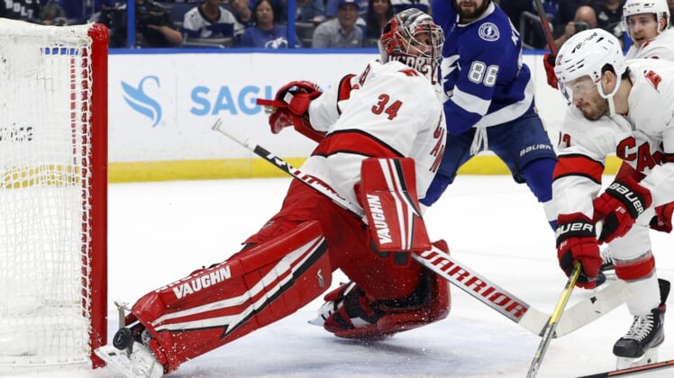 Jun 5, 2021; Tampa, Florida, USA; Carolina Hurricanes goaltender Petr Mrazek (34) makes a save against the Tampa Bay Lightning during the first period in game four of the second round of the 2021 Stanley Cup Playoffs at Amalie Arena. Mandatory Credit: Kim Klement-USA TODAY Sports