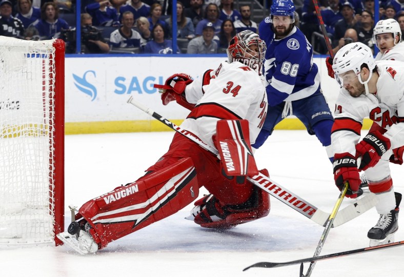 Jun 5, 2021; Tampa, Florida, USA; Carolina Hurricanes goaltender Petr Mrazek (34) makes a save against the Tampa Bay Lightning during the first period in game four of the second round of the 2021 Stanley Cup Playoffs at Amalie Arena. Mandatory Credit: Kim Klement-USA TODAY Sports