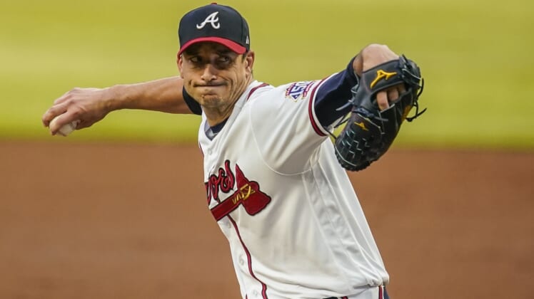 Jun 5, 2021; Cumberland, Georgia, USA; Atlanta Braves starting pitcher Charlie Morton (50) pitches against the Los Angeles Dodgers during the third inning at Truist Park. Mandatory Credit: Dale Zanine-USA TODAY Sports