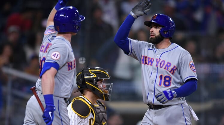 Jun 5, 2021; San Diego, California, USA; New York Mets second baseman Jose Peraza (18) is congratulated by right fielder Billy McKinney (left) after hitting a home run against the San Diego Padres during the fifth inning at Petco Park. Mandatory Credit: Orlando Ramirez-USA TODAY Sports