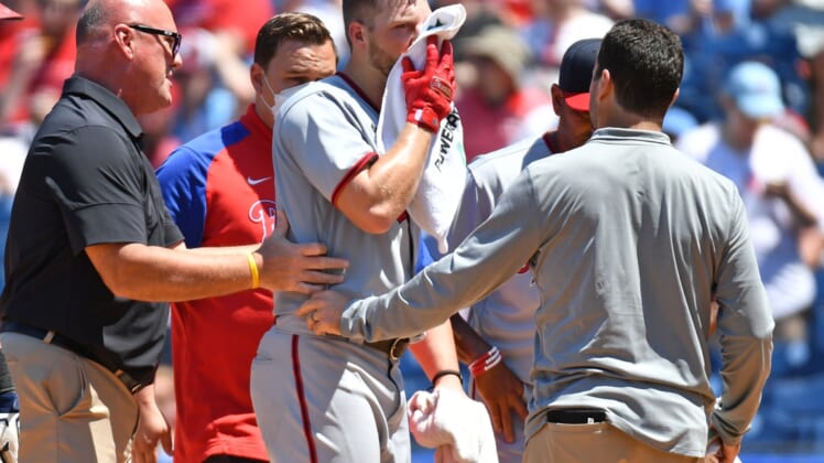 Jun 6, 2021; Philadelphia, Pennsylvania, USA; Washington Nationals starting pitcher Austin Voth (50) is helped off the field after being hit in the face by a pitch against the Philadelphia Phillies at Citizens Bank Park. Mandatory Credit: Eric Hartline-USA TODAY Sports
