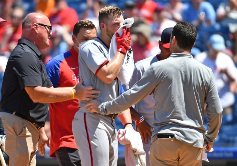 Jun 6, 2021; Philadelphia, Pennsylvania, USA; Washington Nationals starting pitcher Austin Voth (50) is helped off the field after being hit in the face by a pitch against the Philadelphia Phillies at Citizens Bank Park. Mandatory Credit: Eric Hartline-USA TODAY Sports