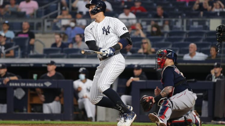 Jun 6, 2021; Bronx, New York, USA; New York Yankees designated hitter Aaron Judge (99) follows through on an RBI fielder's choice against the Boston Red Sox during the fourth inning at Yankee Stadium. Mandatory Credit: Brad Penner-USA TODAY Sports