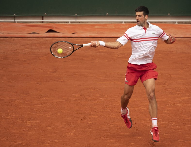 Jun 7, 2021; Paris, France; Novak Djokovic (SRB) in action during his match against Lorenzo Musetti (ITA) on day nine of the French Open at Stade Roland Garros. Mandatory Credit: Susan Mullane-USA TODAY Sports
