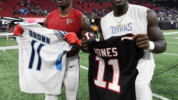 Atlanta Falcons wide receiver Julio Jones (11) and Tennessee Titans wide receiver A.J. Brown (11) exchange jerseys after the Titans' 24-10 win at Mercedes-Benz Stadium Sunday, Sept. 29, 2019 in Atlanta, Ga.