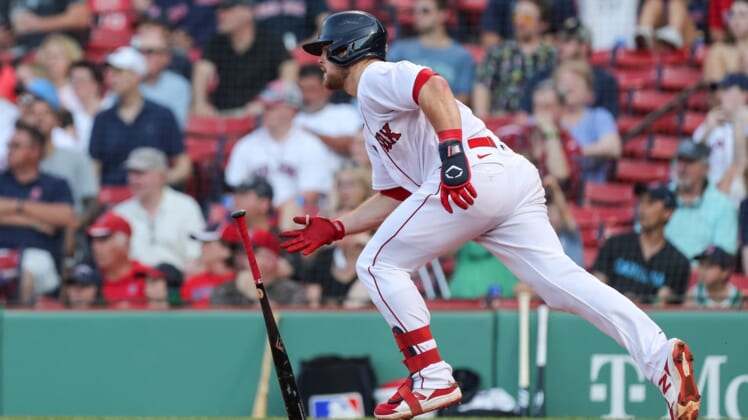 Jun 7, 2021; Boston, Massachusetts, USA; Boston Red Sox second baseman Christian Arroyo (39) hits a RBI single during the fourth inning against the Miami Marlins at Fenway Park. Mandatory Credit: Paul Rutherford-USA TODAY Sports