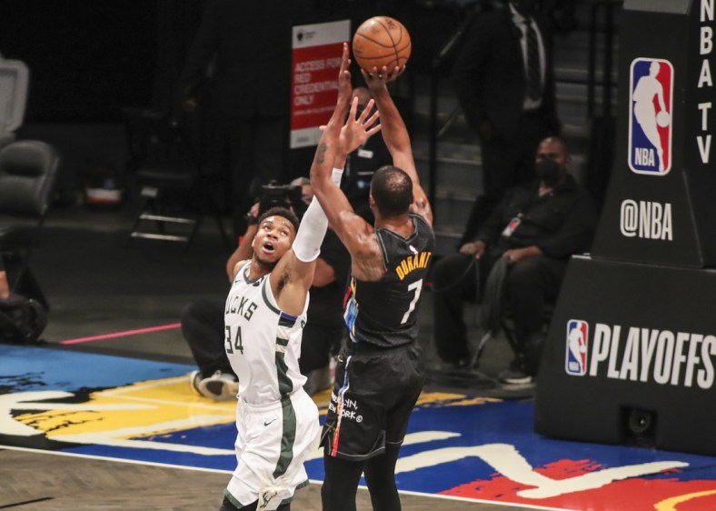 Jun 7, 2021; Brooklyn, New York, USA; 
Milwaukee Bucks forward Giannis Antetokounmpo (34) tries to block a shot taken by Brooklyn Nets forward Kevin Durant (7) in the first quarter during game two in the second round of the 2021 NBA Playoffs. at Barclays Center. Mandatory Credit: Wendell Cruz-USA TODAY Sports