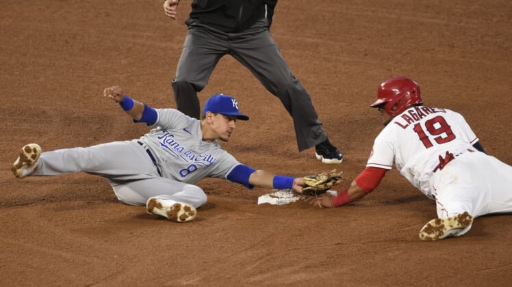Jun 7, 2021; Anaheim, California, USA; Los Angeles Angels center fielder Juan Lagares (19) steals second base against Kansas City Royals shortstop Nicky Lopez (8) during the fourth inning at Angel Stadium. Mandatory Credit: Kelvin Kuo-USA TODAY Sports