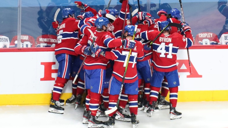 Jun 7, 2021; Montreal, Quebec, CAN; Montreal Canadiens players celebrate their win against Winnipeg Jets in the game four of the second round of the 2021 Stanley Cup Playoffs at Bell Centre. Mandatory Credit: Jean-Yves Ahern-USA TODAY Sports