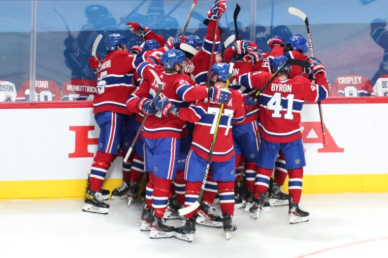 Jun 7, 2021; Montreal, Quebec, CAN; Montreal Canadiens players celebrate their win against Winnipeg Jets in the game four of the second round of the 2021 Stanley Cup Playoffs at Bell Centre. Mandatory Credit: Jean-Yves Ahern-USA TODAY Sports