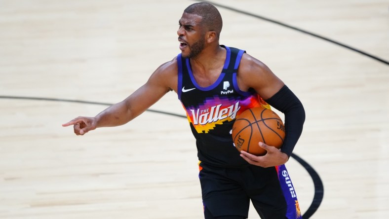 Jun 7, 2021; Phoenix, Arizona, USA; Phoenix Suns guard Chris Paul reacts against the Denver Nuggets in the first half during game one in the second round of the 2021 NBA Playoffs at Phoenix Suns Arena. Mandatory Credit: Mark J. Rebilas-USA TODAY Sports