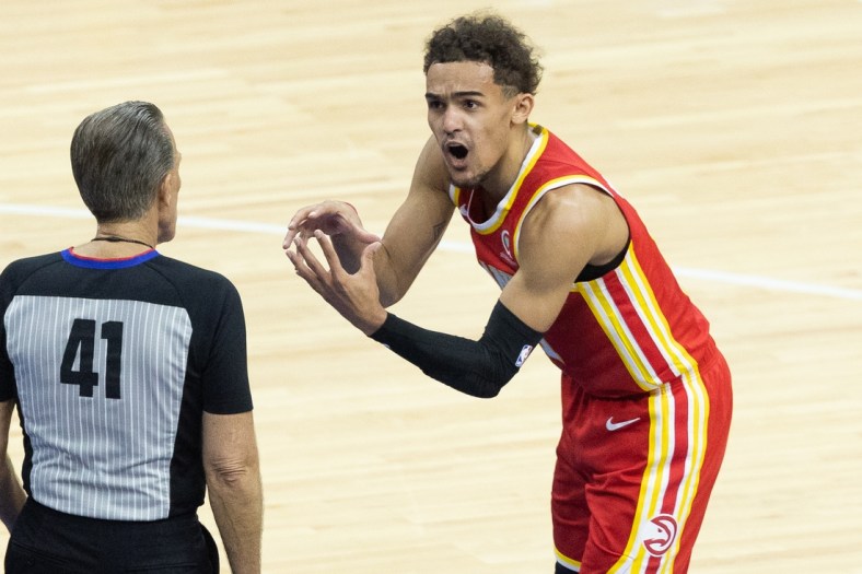 Jun 8, 2021; Philadelphia, Pennsylvania, USA; Atlanta Hawks guard Trae Young (11) argues a call with referee Ken Mauer (41) during the first quarter in game two of the second round of the 2021 NBA Playoffs against the Philadelphia 76ers at Wells Fargo Center. Mandatory Credit: Bill Streicher-USA TODAY Sports