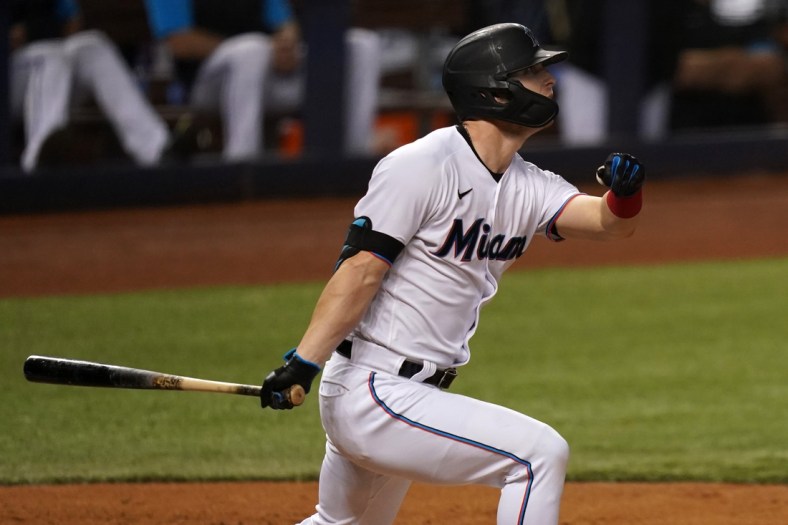 Jun 8, 2021; Miami, Florida, USA; Miami Marlins left fielder Corey Dickerson (23) triples in two runs in the 3rd inning against the Colorado Rockies at loanDepot park. Mandatory Credit: Jasen Vinlove-USA TODAY Sports