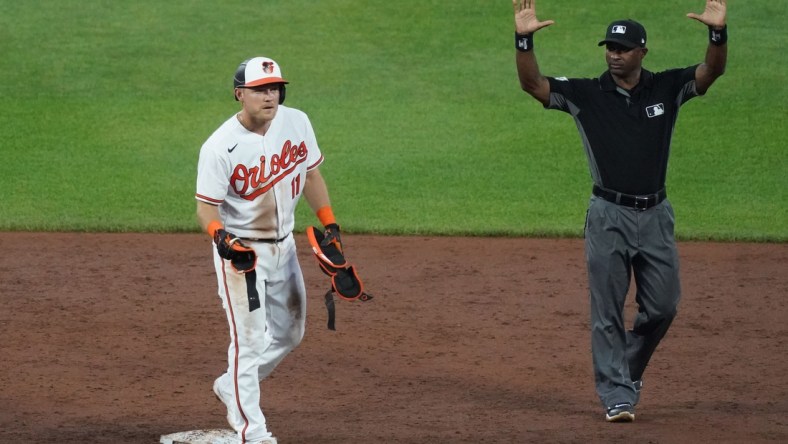 Jun 8, 2021; Baltimore, Maryland, USA; Baltimore Orioles second baseman Pat Valaika (11) calls for timeout after driving in a run with a double in the third inning against the New York Mets at Oriole Park at Camden Yards. Mandatory Credit: Mitch Stringer-USA TODAY Sports