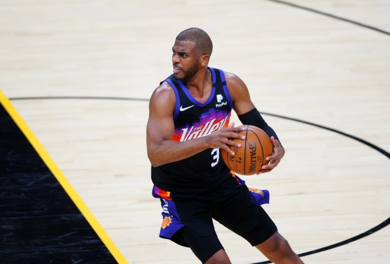 Jun 7, 2021; Phoenix, Arizona, USA; Phoenix Suns guard Chris Paul (3) against the Denver Nuggets during game one in the second round of the 2021 NBA Playoffs at Phoenix Suns Arena. Mandatory Credit: Mark J. Rebilas-USA TODAY Sports
