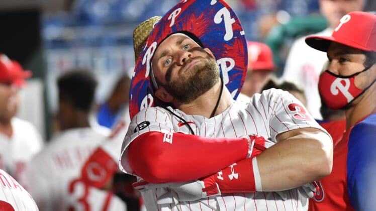 Jun 8, 2021; Philadelphia, Pennsylvania, USA; Philadelphia Phillies right fielder Bryce Harper (3) celebrates in the dugout after hitting a solo home run against the Atlanta Braves during the fourth inning at Citizens Bank Park. Mandatory Credit: Eric Hartline-USA TODAY Sports