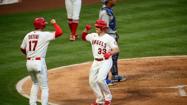 Jun 8, 2021; Anaheim, California, USA; Los Angeles Angels catcher Max Stassi (33) is greeted by designated hitter Shohei Ohtani (17) after hitting a two run home run against the Kansas City Royals during the third inning at Angel Stadium. Mandatory Credit: Gary A. Vasquez-USA TODAY Sports