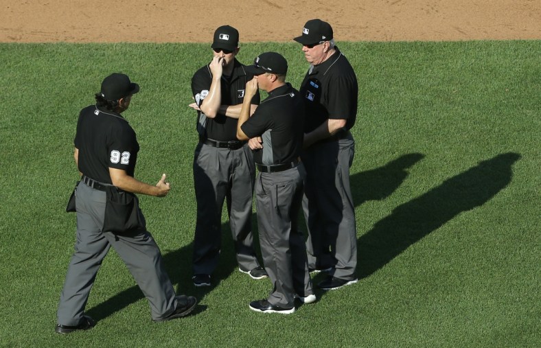 Jun 5, 2021; Pittsburgh, Pennsylvania, USA;  Home plate umpire James Hoye (92) talks with fellow umpires Sean Barber (29) and Cory Blaser (middle) and Brian Gorman (right) during the game between the Miami Marlins and the Pittsburgh Pirates in the fourth inning at PNC Park. Mandatory Credit: Charles LeClaire-USA TODAY Sports