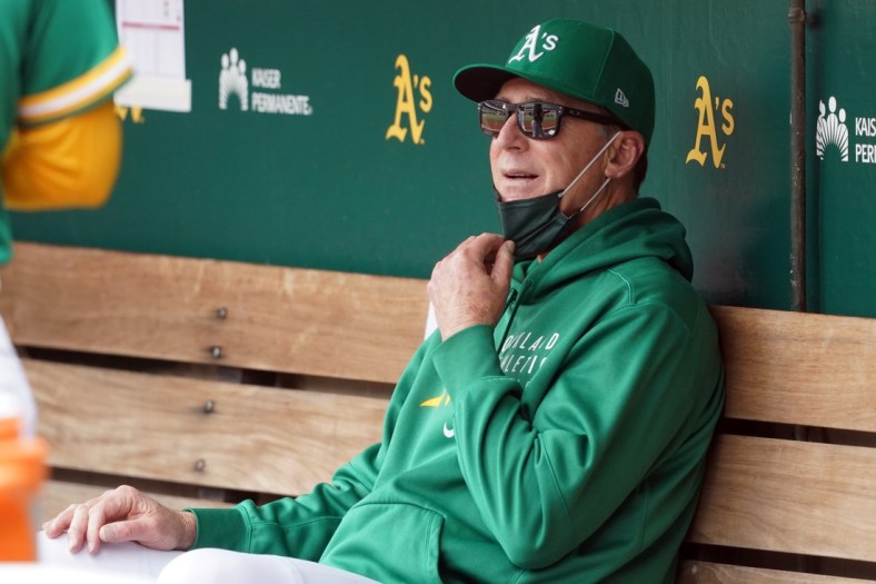 May 29, 2021; Oakland, California, USA; Oakland Athletics manager Bob Melvin (6) sits in the dugout before the game against the Los Angeles Angels at RingCentral Coliseum. Mandatory Credit: Darren Yamashita-USA TODAY Sports