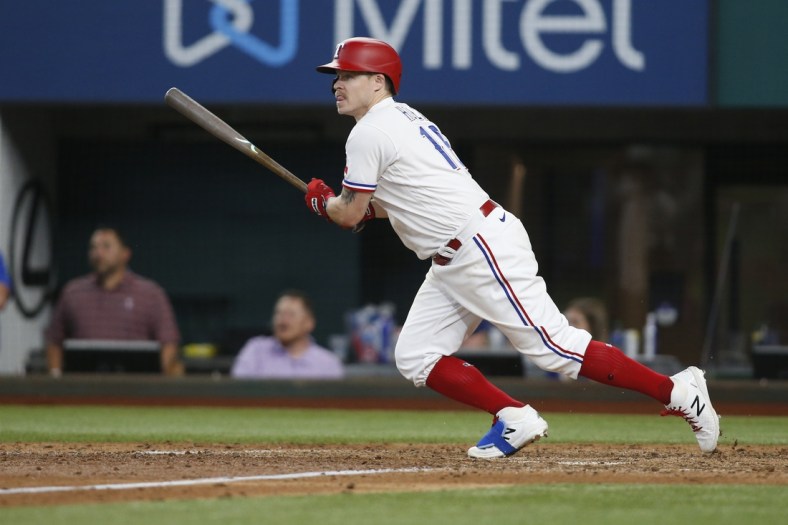 Jun 9, 2021; Arlington, Texas, USA; Texas Rangers third baseman Brock Holt (16) drives in the winning run in the eleventh inning with a single against the San Francisco Giants at Globe Life Field. Mandatory Credit: Tim Heitman-USA TODAY Sports