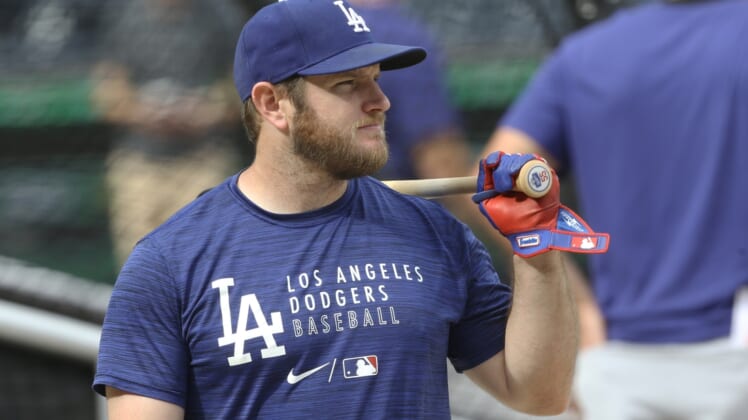 Jun 9, 2021; Pittsburgh, Pennsylvania, USA;  Los Angeles Dodgers first baseman Max Muncy (13) at the batting cage before playing the Pittsburgh Pirates at PNC Park. Mandatory Credit: Charles LeClaire-USA TODAY Sports