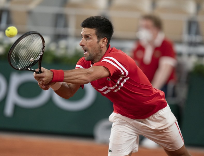 Jun 9, 2021; Paris, France; Novak Djokovic (SRB) in action during his match against Matteo Berrettini (ITA) on day 11 of the French Open at Stade Roland Garros. Mandatory Credit: Susan Mullane-USA TODAY Sports