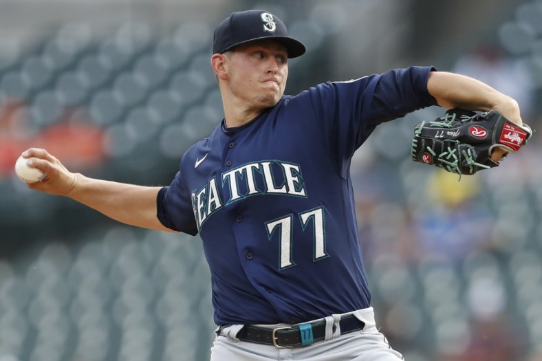 Jun 9, 2021; Detroit, Michigan, USA; Seattle Mariners starting pitcher Chris Flexen (77) throws a pitch during the first inning against the Detroit Tigers at Comerica Park. Mandatory Credit: Raj Mehta-USA TODAY Sports