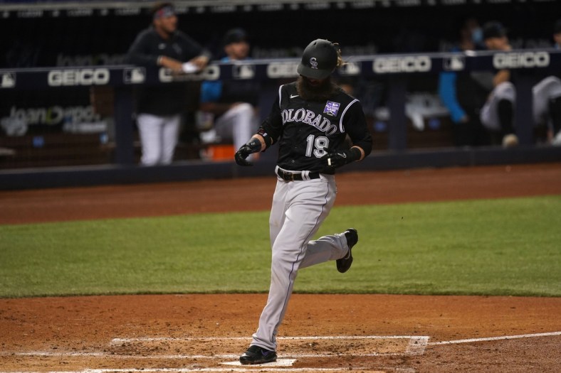 Jun 9, 2021; Miami, Florida, USA; Colorado Rockies right fielder Charlie Blackmon (19) scores a run in the 3rd inning against the Miami Marlins at loanDepot park. Mandatory Credit: Jasen Vinlove-USA TODAY Sports