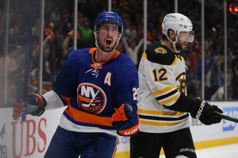 Jun 9, 2021; Uniondale, New York, USA; New York Islanders center Brock Nelson (29) celebrates his goal against the Boston Bruins in front of Bruins right wing Craig Smith (12) during the second period of game six of the second round of the 2021 Stanley Cup Playoffs at Nassau Veterans Memorial Coliseum. Mandatory Credit: Brad Penner-USA TODAY Sports