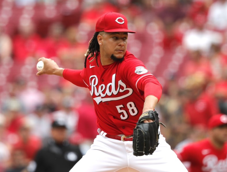 Jun 10, 2021; Cincinnati, Ohio, USA; Cincinnati Reds starting pitcher Luis Castillo (58) throws against the Milwaukee Brewers during the first inning at Great American Ball Park. Mandatory Credit: David Kohl-USA TODAY Sports