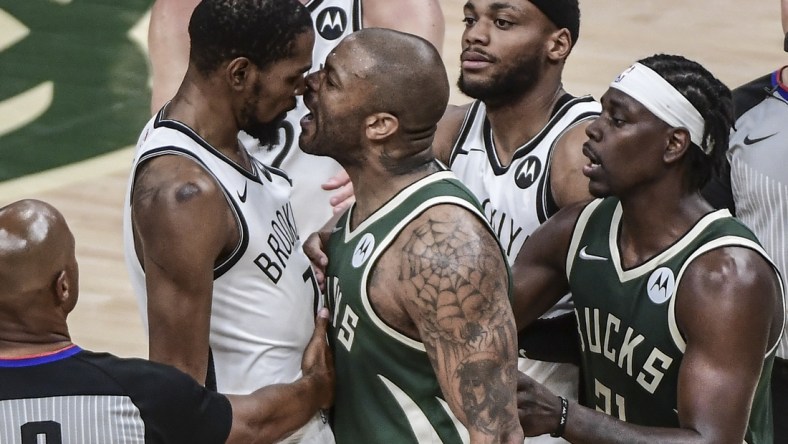 Jun 10, 2021; Milwaukee, Wisconsin, USA; Milwaukee Bucks forward P.J. Tucker (17) yells in the face of Brooklyn Nets forward Kevin Durant (7) in the third quarter during game three in the second round of the 2021 NBA Playoffs at Fiserv Forum. Mandatory Credit: Benny Sieu-USA TODAY Sports