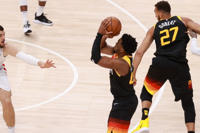 Jun 10, 2021; Salt Lake City, Utah, USA; Utah Jazz guard Donovan Mitchell (45) shoots a three-point shot during the first quarter against the LA Clippers during game two of the second round of the 2021 NBA Playoffs at Vivint Arena. Mandatory Credit: Chris Nicoll-USA TODAY Sports